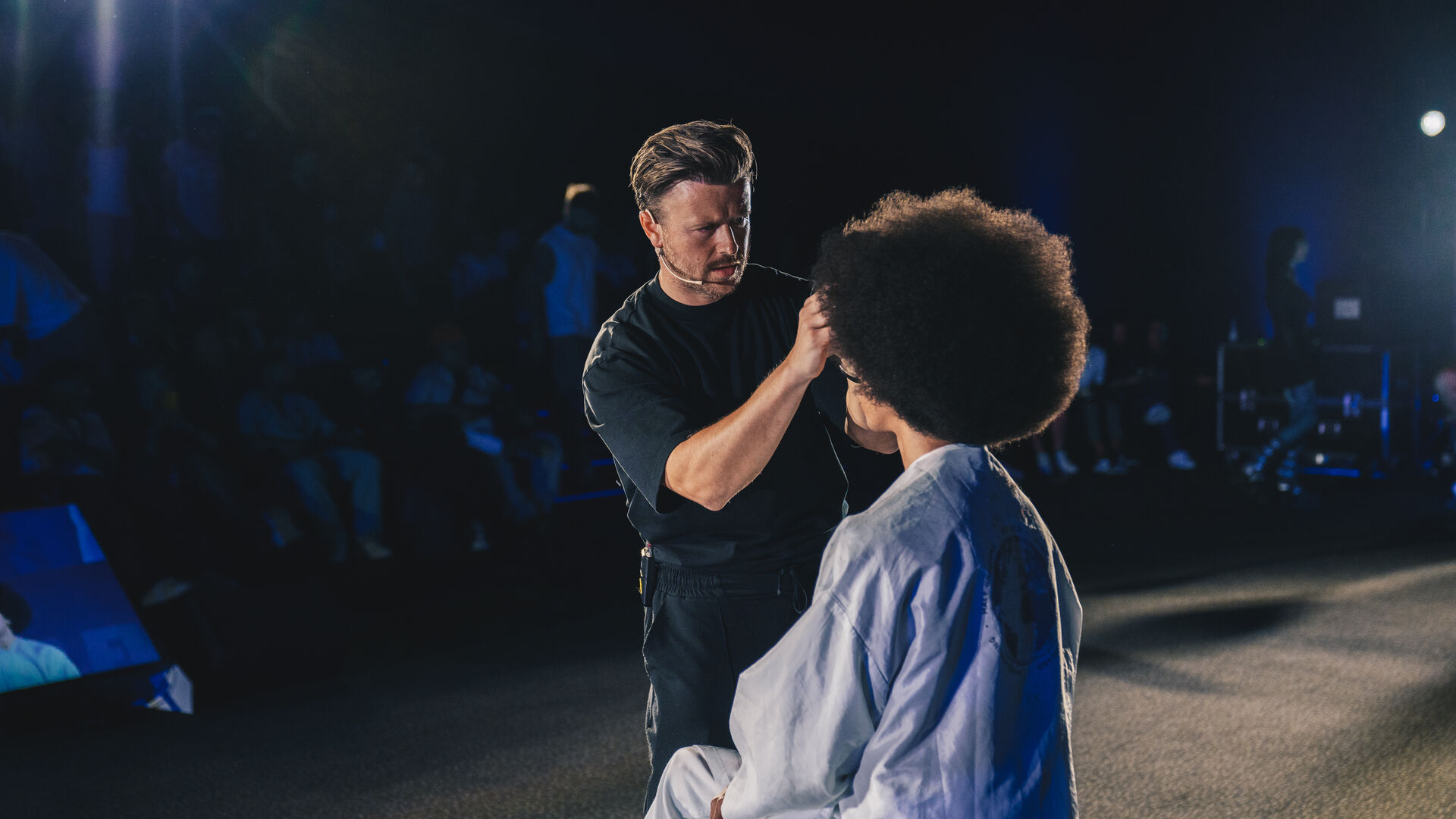 Barber working on client at SHOWCASE